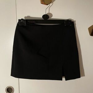 Black mini skirt with slit